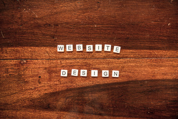 Word tiles on a wooden background