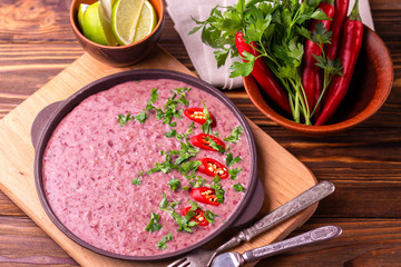 Mexican red bean puree soup with lime, parsley and chilli pepper.