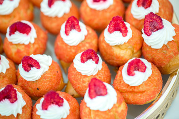 close up of profiteroles with cream