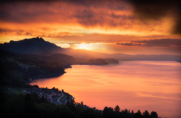 Beautiful view on to the lake thun in Switzerland. Wonderful sunset in the canton of bern in Switzerland.