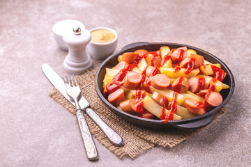 Peruvian Salchipapa Fries with sauces. French fries, sausages. Fastfood