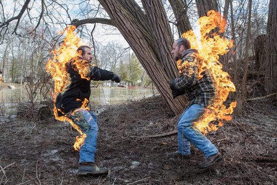 Stunt Men light themselves on fire and fight in their backyard