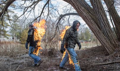 Stunt Men light themselves on fire and fight in their backyard