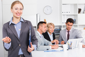 Fototapeta premium Smiling businesswoman welcoming to office