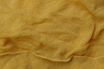 yellow fabric texture from a piece of crumpled cloth