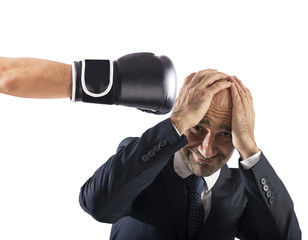 Businessman receives fists from competitors. concept of difficult career