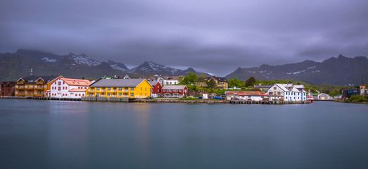Fototapeta premium Henningsvaer- June 15, 2018: Colorful houses of a small village in the Lofoten Islands, Norway