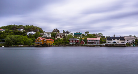 Fototapeta premium Henningsvaer- June 15, 2018: Colorful houses of a small village in the Lofoten Islands, Norway