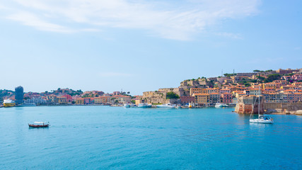 Fototapeta na wymiar Portoferraio medieval town and harbour viewed from the sea, Elba island, Tuscany, Italy