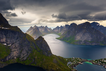 Naklejka na ściany i meble Panoramic view of the fishing town of Reine from the top of the Reinebringen viewpoint in the Lofoten Islands, Norway