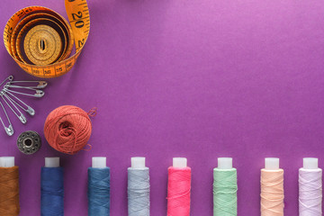 Multicolored coils with threads on a violet background