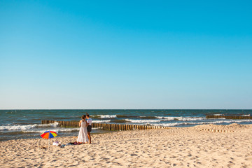 two girls on the beach by the sea