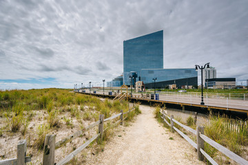 Sand dune path and the boardwalk in Atlantic City, New Jersey.