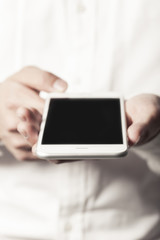 business man hand hold a mobile phone on the white background.