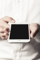 business man hand hold a mobile phone on the white background.