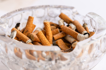 Ashtray filled with cigarette butts.
