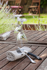 empy glasses of wine and Cutlery on a rustic table