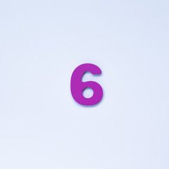Wooden number 6 with purple color on white background.