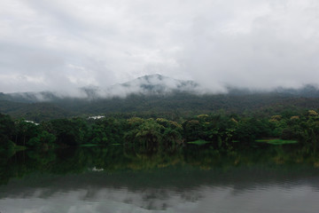 View of the reservoir Mountains and fog in the morning
