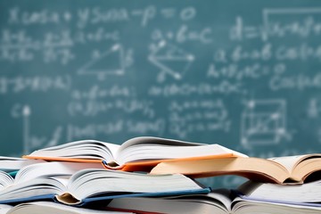 Stack of books on school background