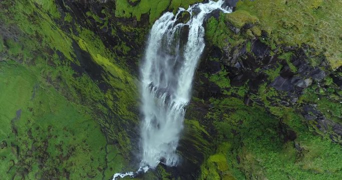 Smooth aerial of exotic huge waterfall in south Iceland