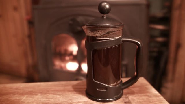 Coffee cafetiere brewing by fire