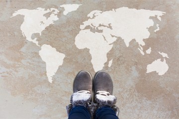 Grey fashion shoes on world map background