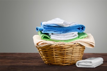 Laundry Basket with colorful towels on desk
