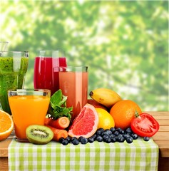Composition of fruits and glasses of juice