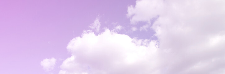 A blue sky with lots of white clouds of different sizes