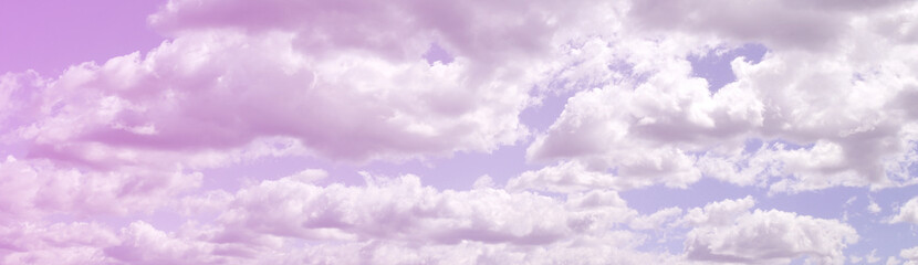 A blue sky with lots of white clouds of different sizes