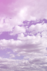 A blue sky with lots of white clouds of different sizes