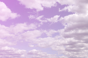 A blue sky with lots of white clouds of different sizes