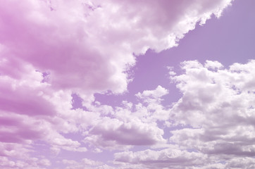 A blue sky with lots of white clouds of different sizes