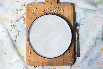 Dirty and empty diss, plate left after finished breakfast, lunch or dinner. Plate with pieces of crumbs and pieces. Kitchenware concept for restaurants and cafes.