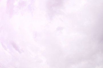 A blue sky with lots of white clouds of different sizes. Fisheye