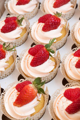 Cupcakes with strawberries and raspberries. Cake for wedding, birthday.