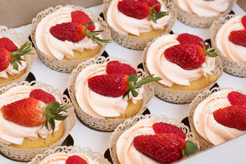 Cupcakes with strawberries and raspberries. Cake for wedding, birthday.