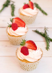 Cupcakes with strawberries and raspberries. Cake for wedding, birthday.