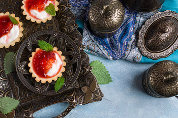 Round tartlets with red jam