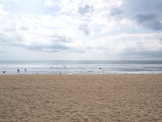 Fototapeta na wymiar Sand and cloud at Kuta Beach, Bali Island. Travel in Indonesia, 12th October 2012