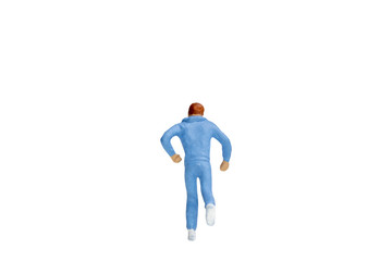 Miniature people running isolated on white background with clipping path
