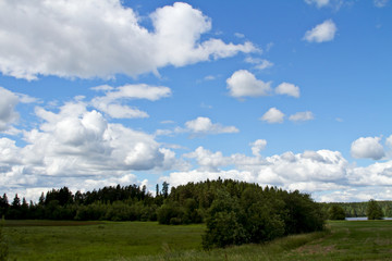 Blue sky and white clouds over finnish countryside