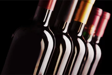 Rolgordijnen Dark wine bottles in row © BillionPhotos.com