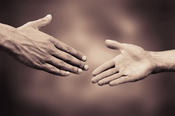 Shake hands on dark background