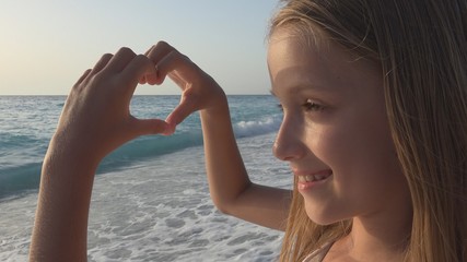 Child Playing on Beach, Kid Watching Sea Waves, Girl Makes Heart Shape Love Sign
