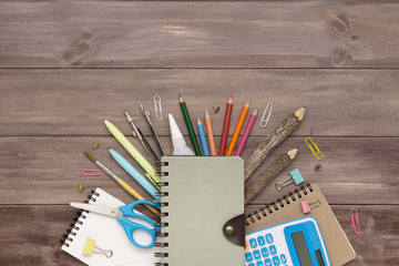 Top view back to school concept and education background concept. School supplies, stationery accessories on wood background.