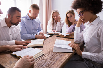 Group Of Young Multiethnic People Reading Bible