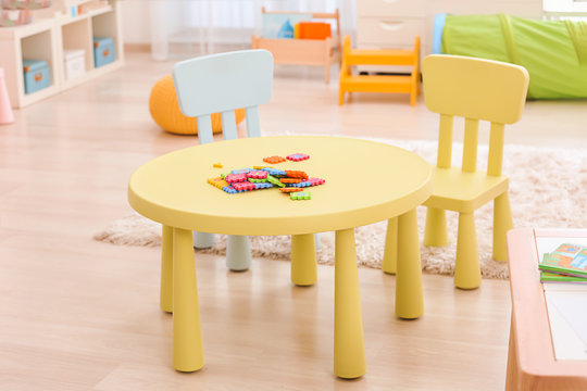 Table with puzzle pieces at child psychologist's office. Autism concept