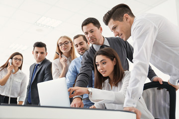 Group of people with business trainer at management seminar